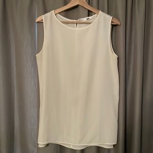 UNIQLO sleeveless white blouse with keyhole back button detail